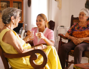 two senior women and a female caregiver